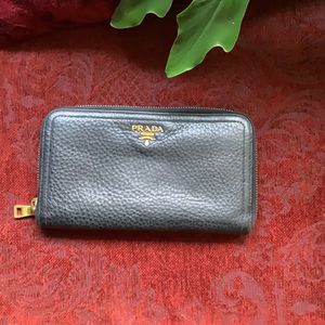 Prada large zip wallet black pebbled leather good condition.